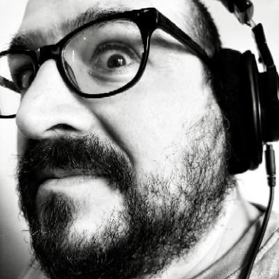 My stupid face in black white, super close up, wearing headphones.