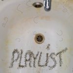 The custom artwork for this week's radio show, by the extraordinary Troggie. It's a sink full of shaved hair that spells out the word "Playlist". It's nasty, and I love it.